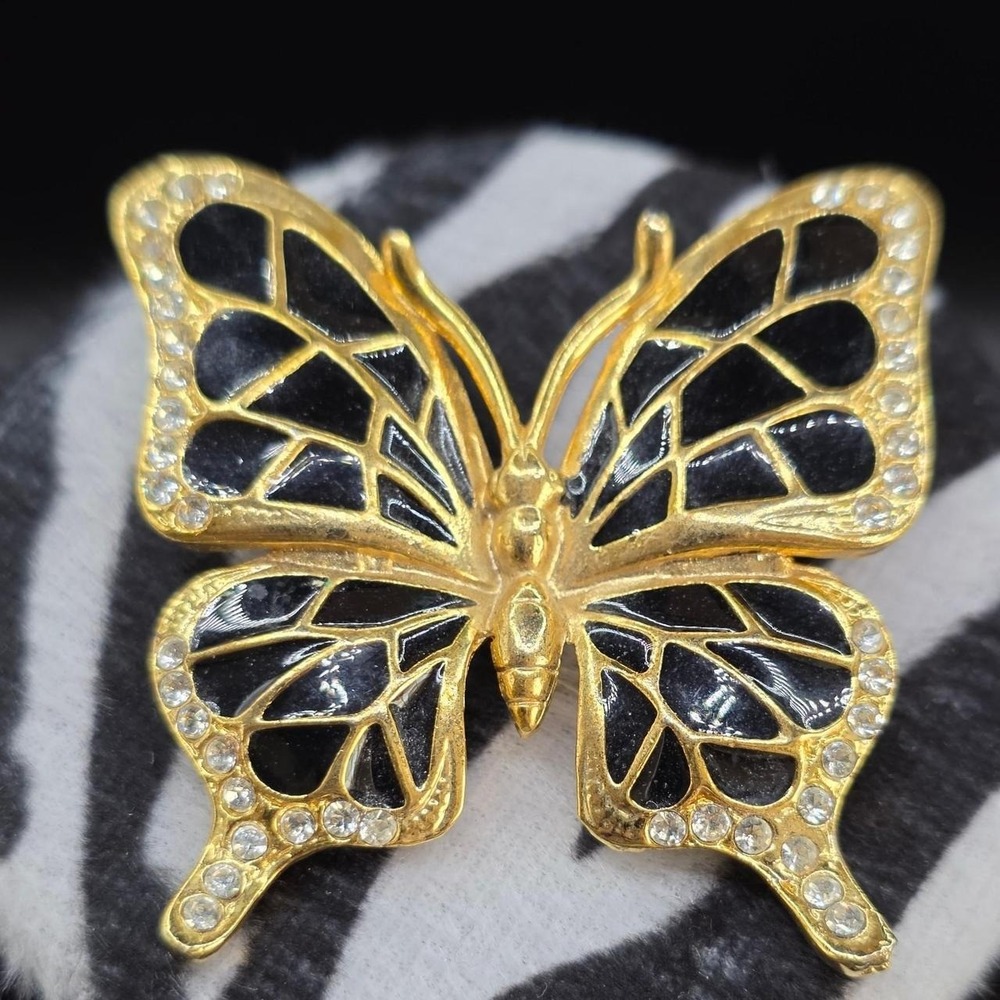 Gold butterfly brooch with black enamel and rhinestones